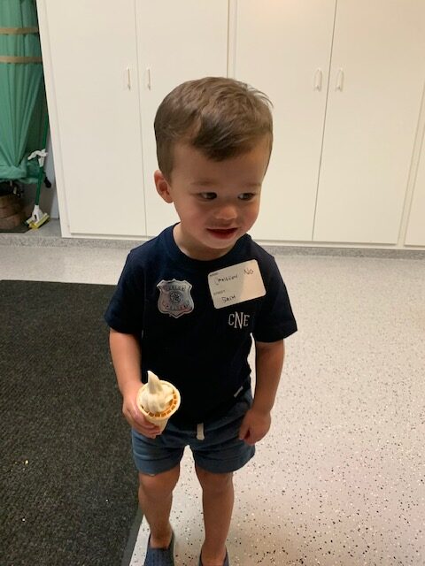 A toddler holding an ice-cream cone
