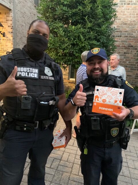 Two Houston police officers smiling at the camera