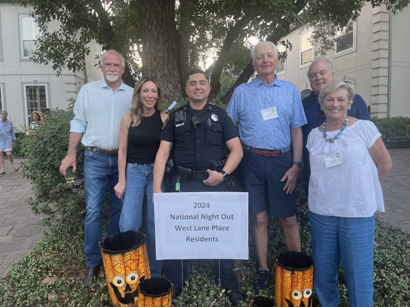 Group of residents with police officer
